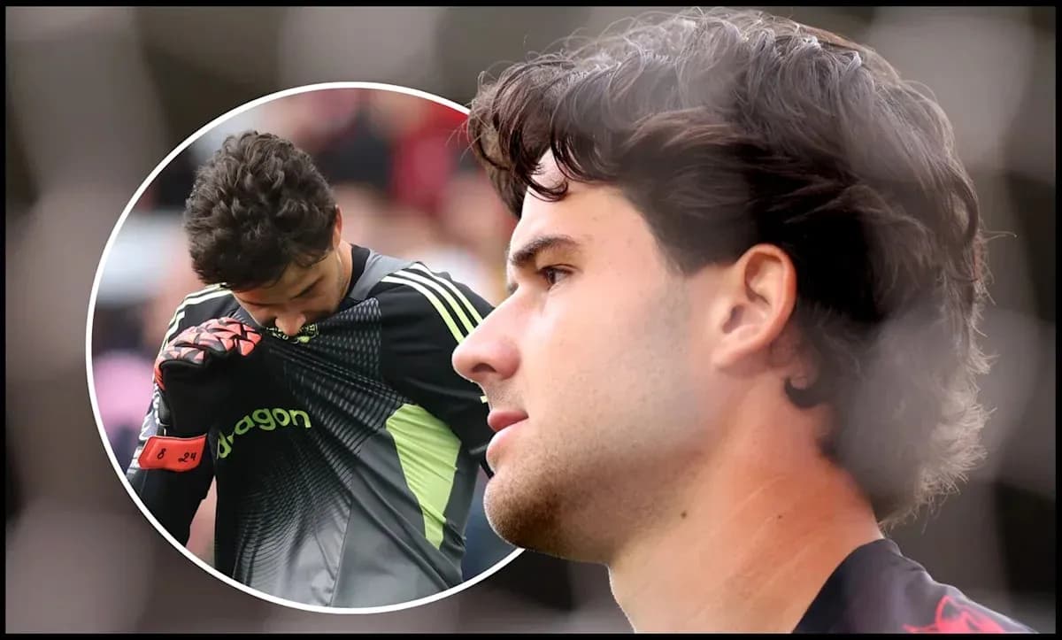 Goalkeeper adjusting his jersey during match