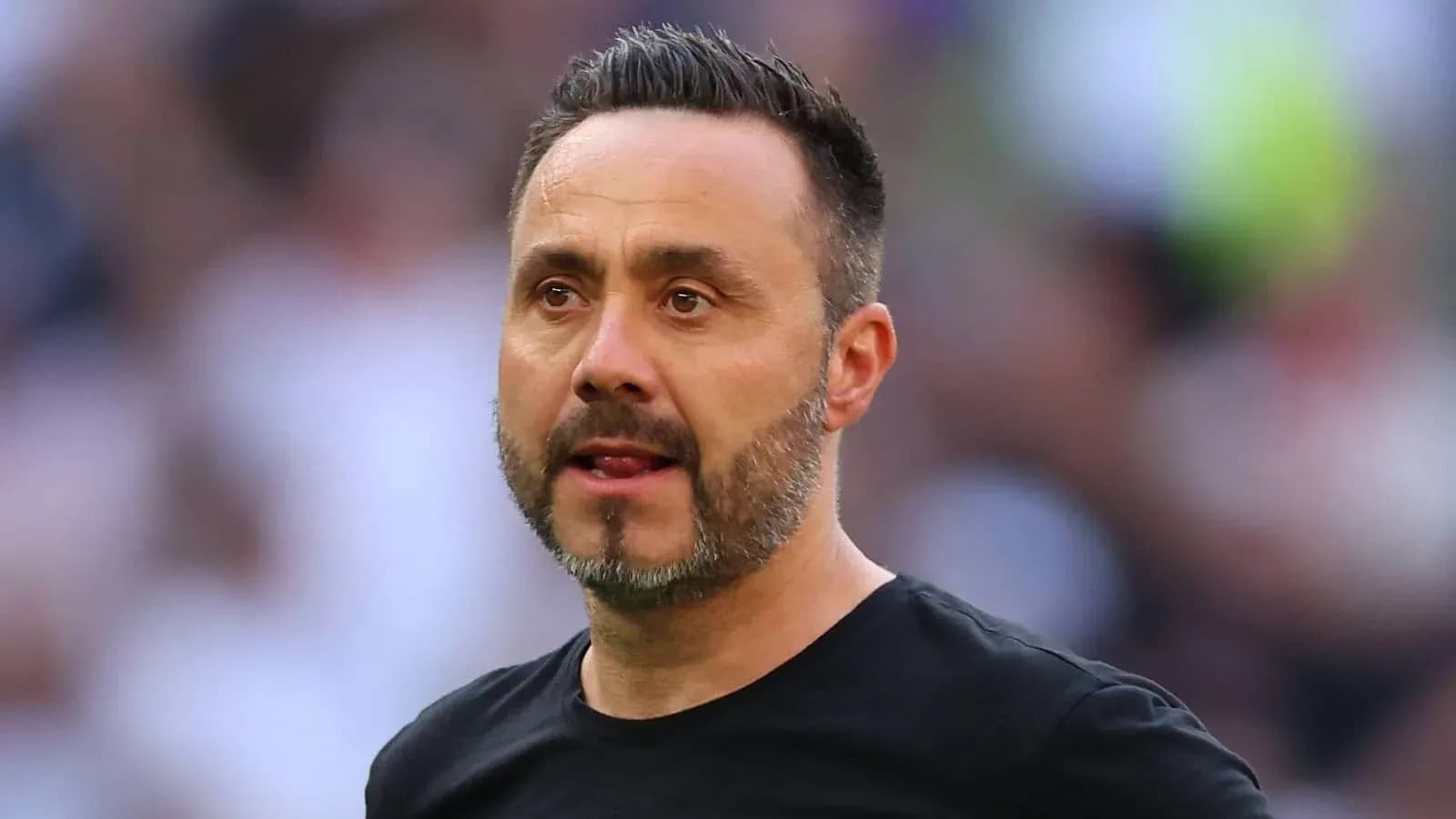 Football manager on the sidelines during match