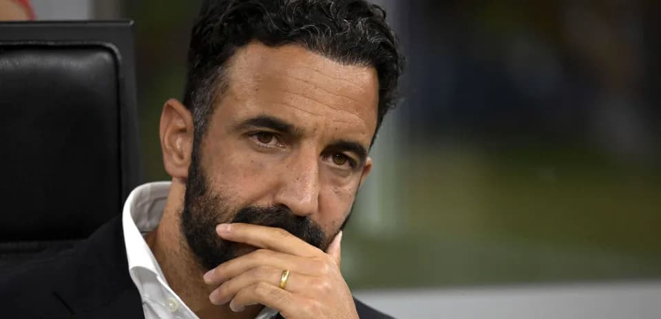 Football manager deep in thought during match