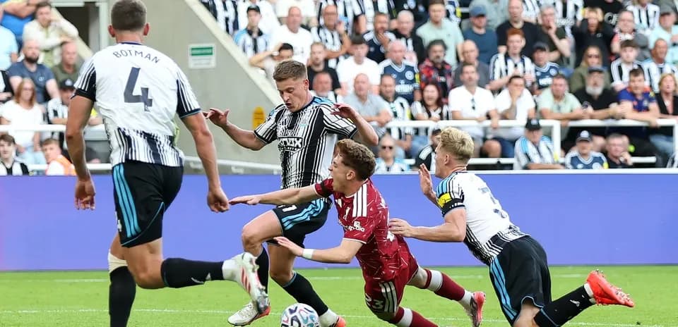 Newcastle players contesting for the ball during match