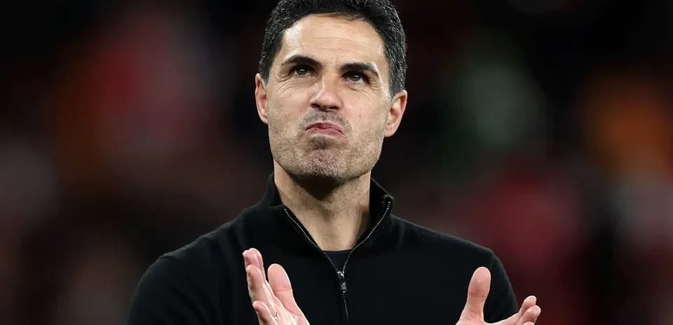 Coach applauding during match at stadium