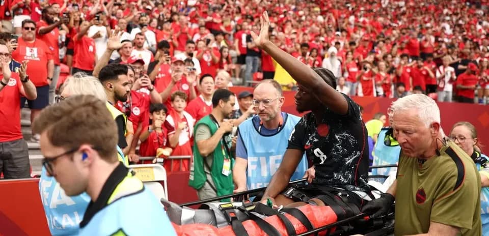 Player being stretchered off by medical staff