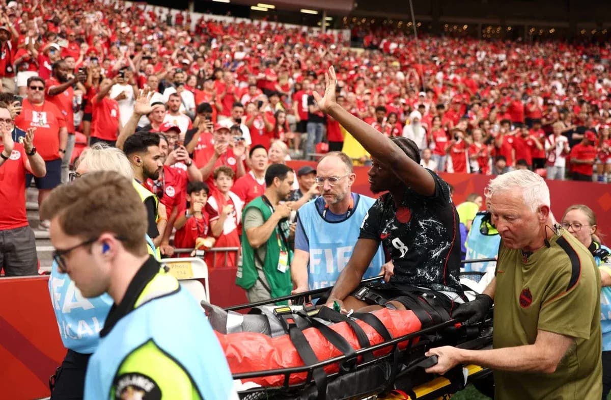 Player being stretchered off by medical staff