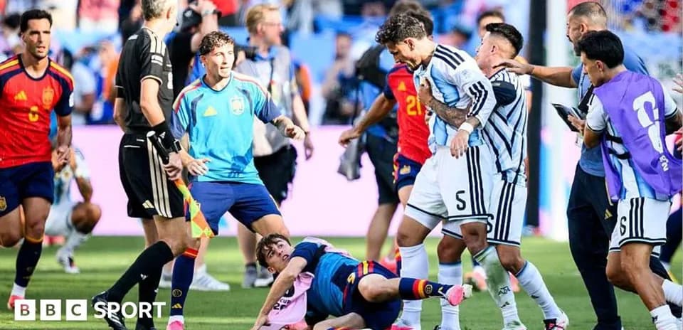 Players from Argentina and Spain arguing on the field