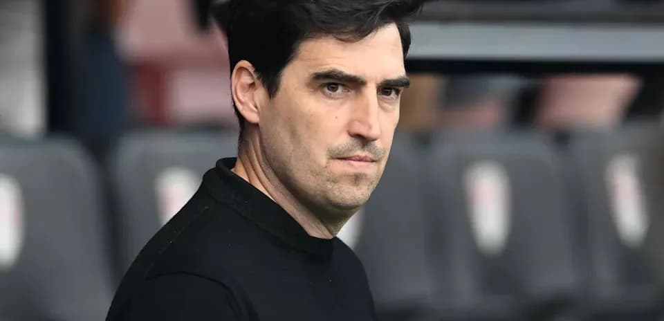 Football manager observing from the sidelines
