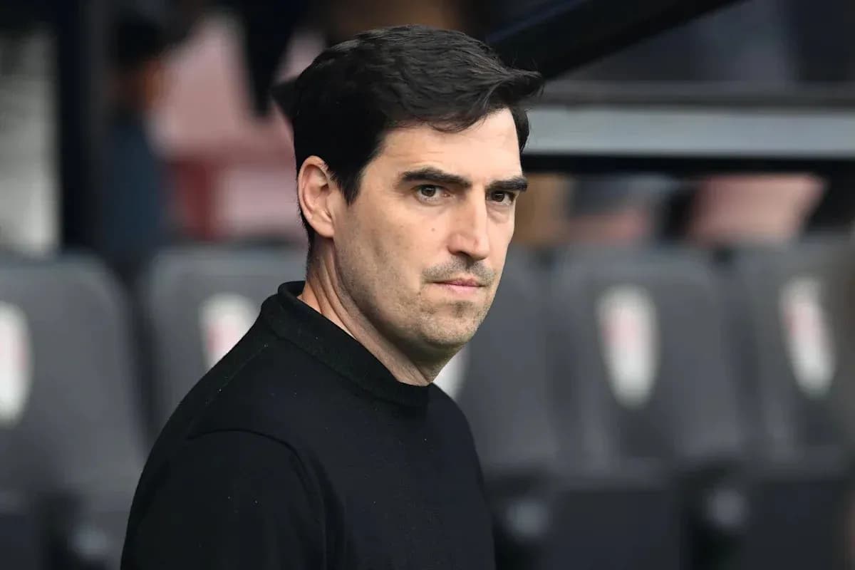 Football manager observing from the sidelines