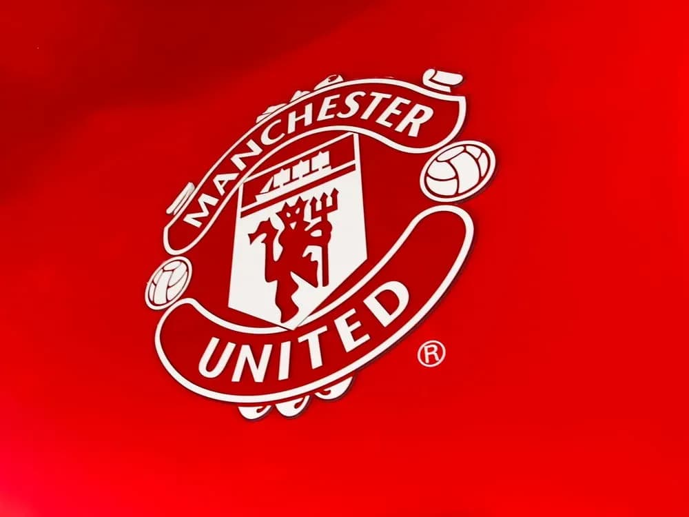 Manchester United logo on red background