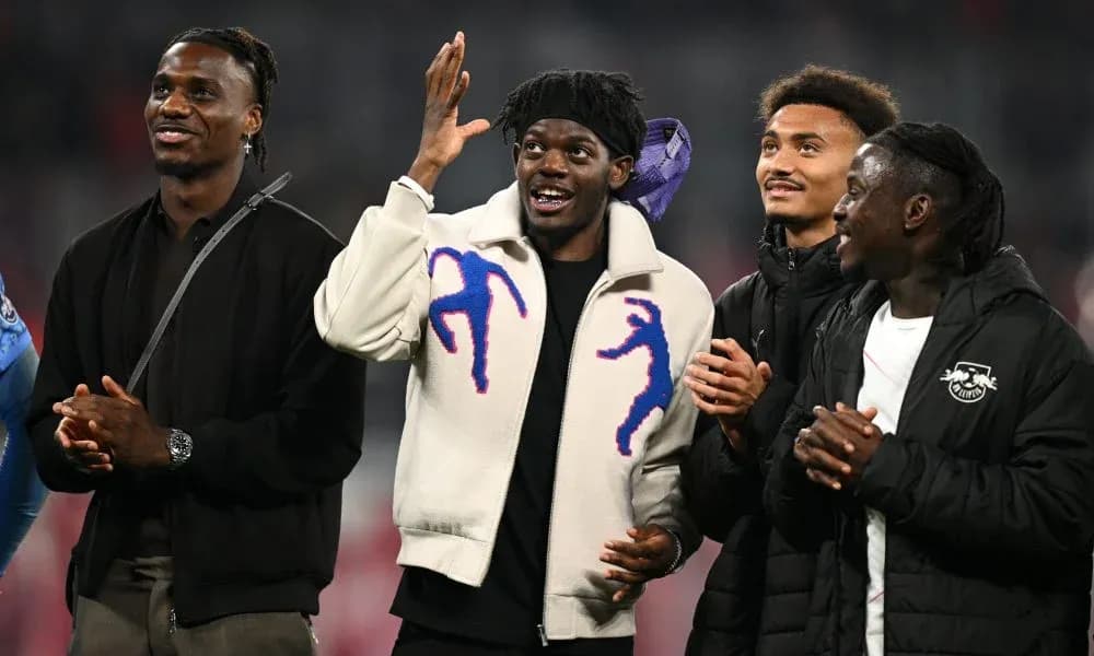 Four players interacting during a match celebration