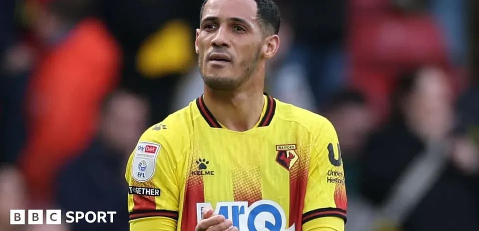 Watford player applauding fans at the stadium