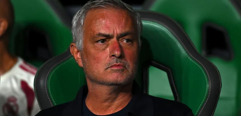 Jose Mourinho seated on the team bench