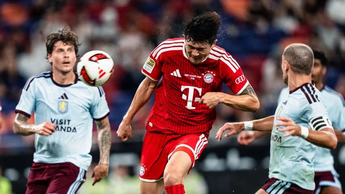 Bayern player heading the ball in match action