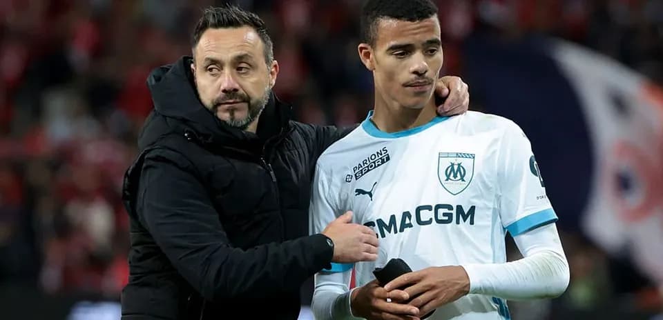 An assistant coach comforting a player after match