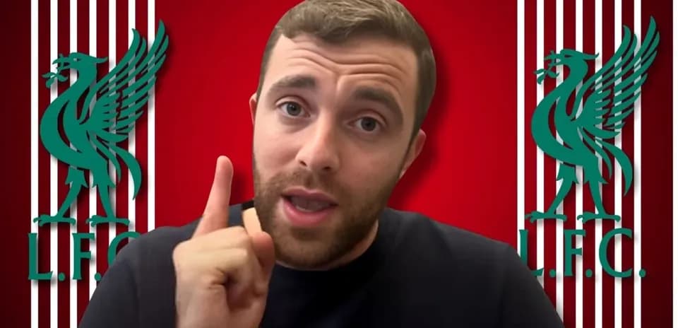 Blogger speaking with Liverpool FC logo background
