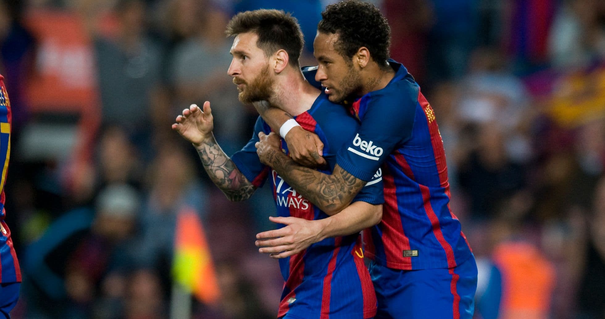 Messi and Neymar celebrating a goal together
