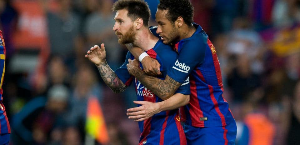 Messi and Neymar celebrating a goal together