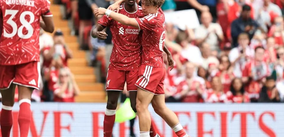 Liverpool players celebrating a goal on the field