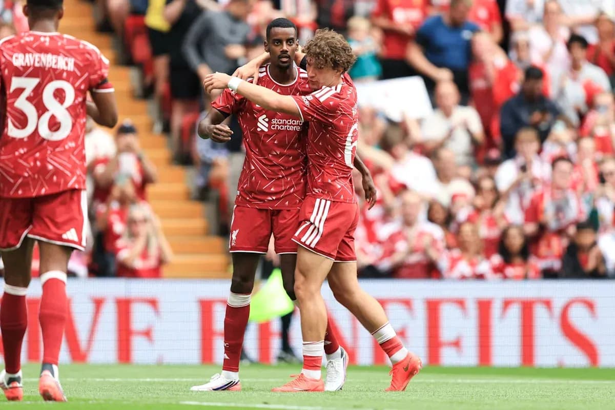 Liverpool players celebrating a goal on the field