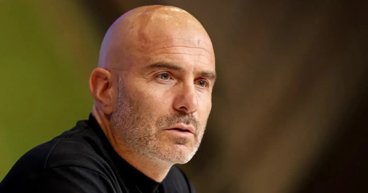 Men's football manager speaking at press conference