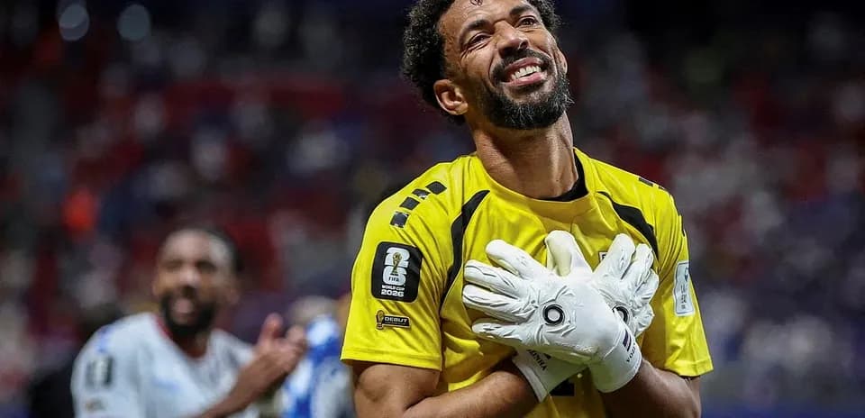 Goalkeeper celebrating after match in yellow jersey
