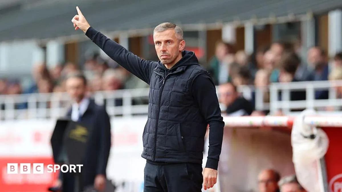 Coach giving instructions from the sidelines during match