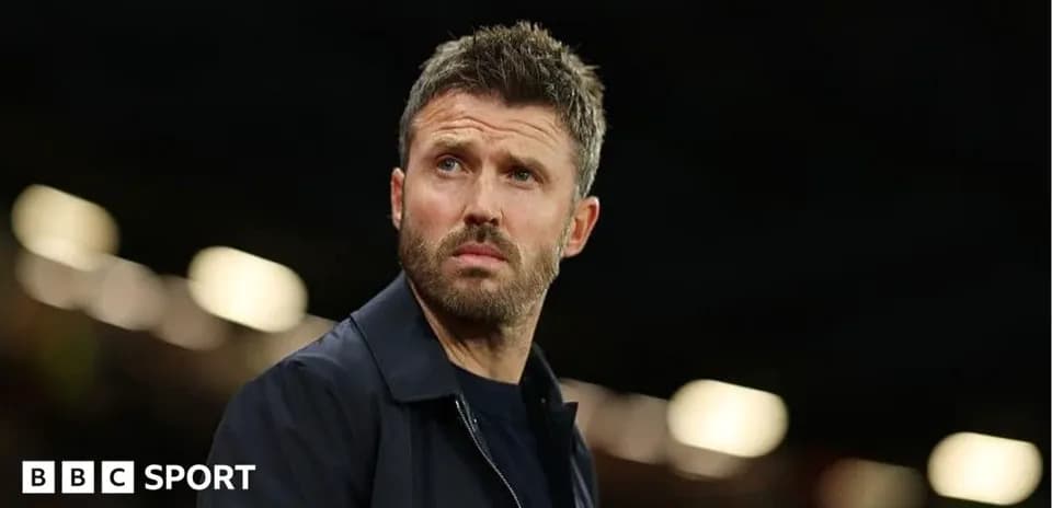 Coach observing match from sidelines