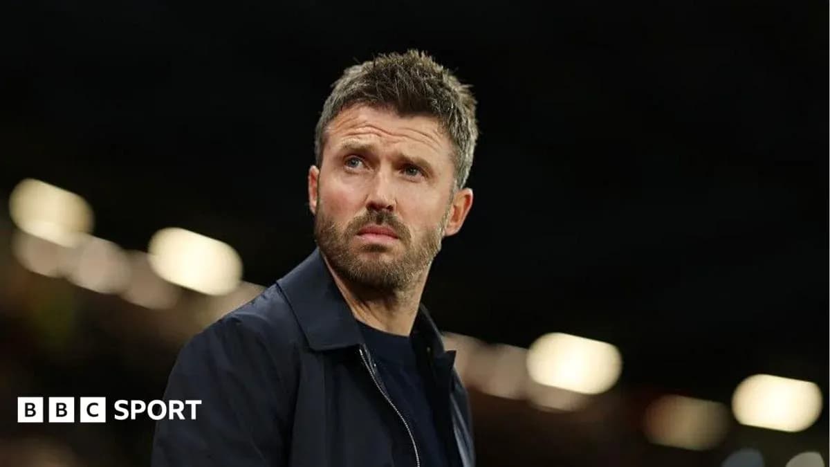 Coach observing match from sidelines