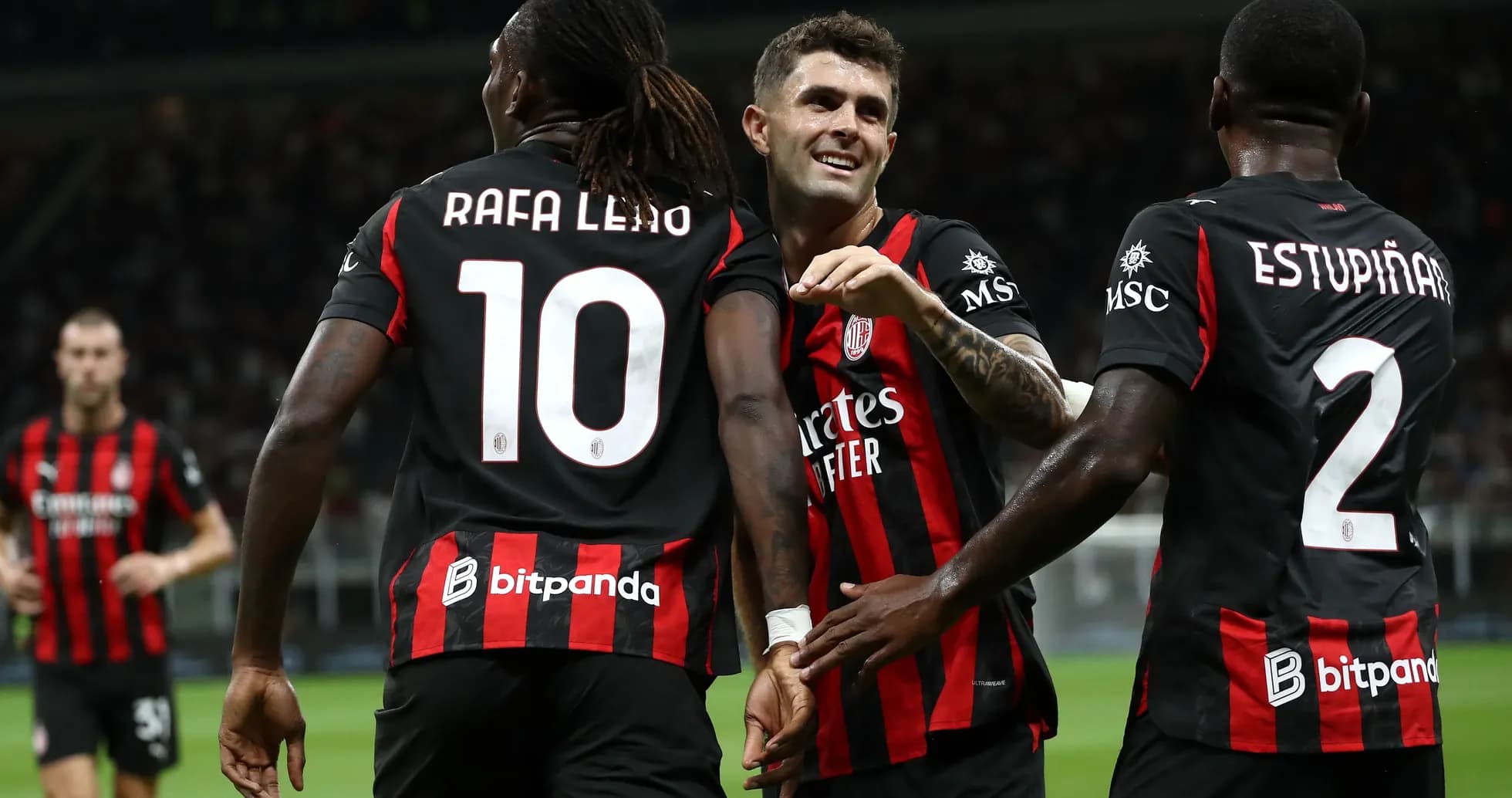 Players celebrating a goal during a match