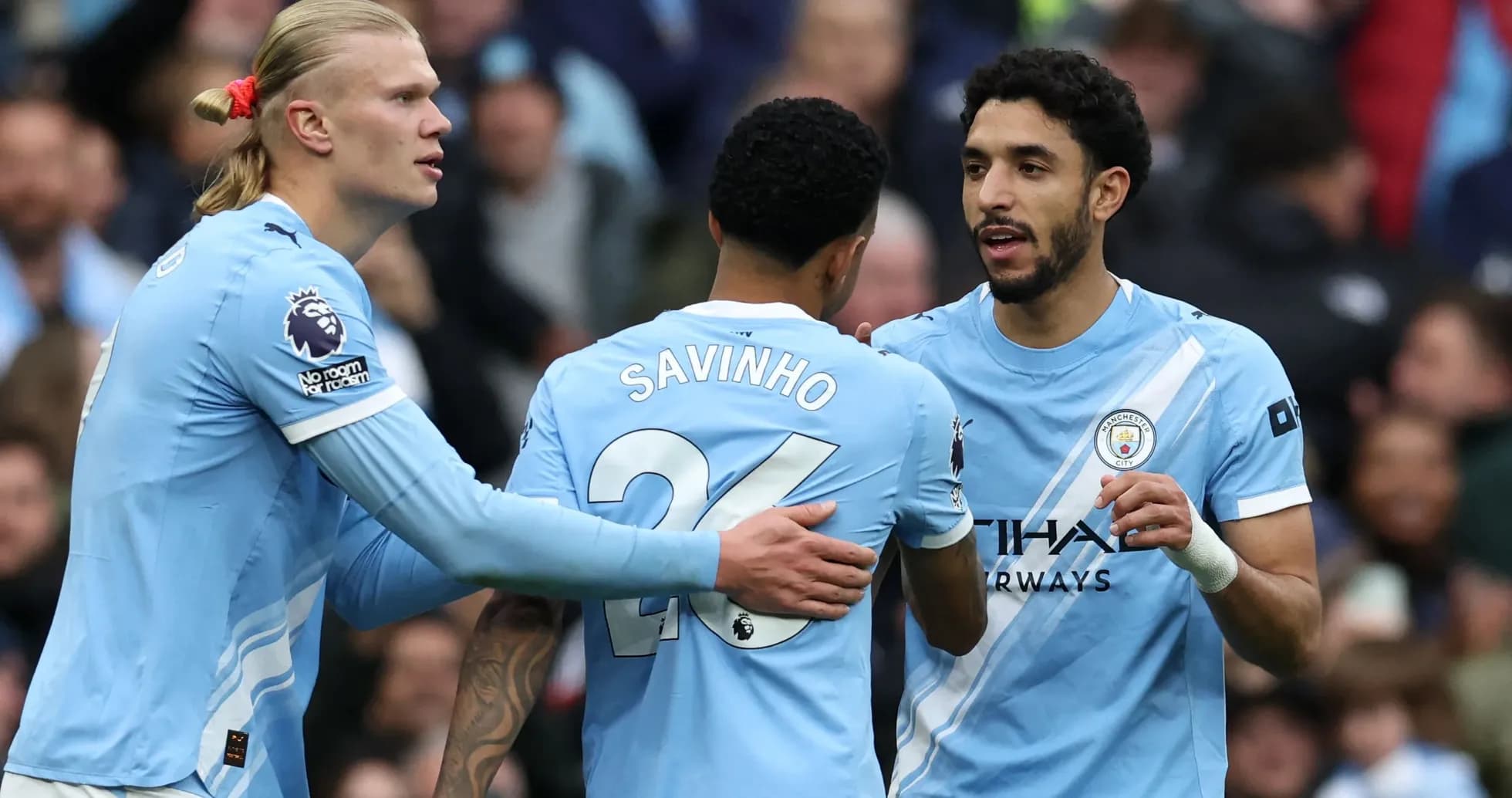 Manchester City players celebrating during a match