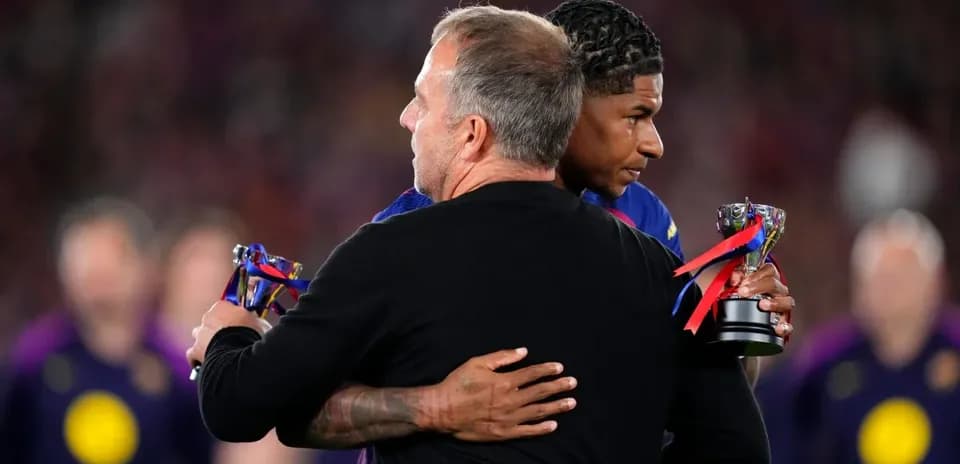 Coach and player embracing after receiving awards