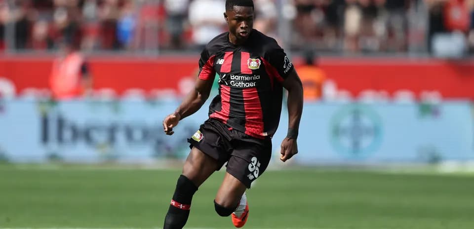 Bayer Leverkusen player dribbling ball during match