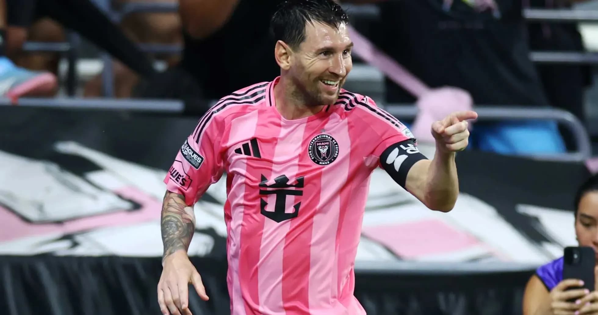 Lionel Messi celebrating in pink Inter Miami jersey