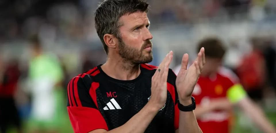 Coach applauding after the match on the field