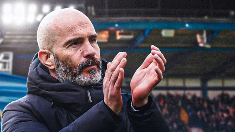 Coach applauding during match at stadium