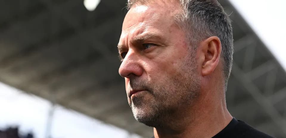 An intense-looking football manager on the sidelines