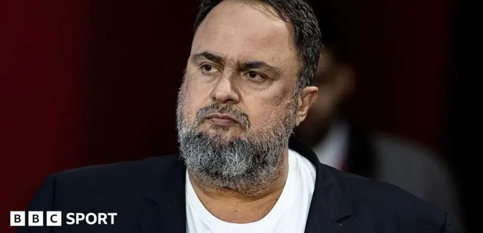Man in suit looking serious at event