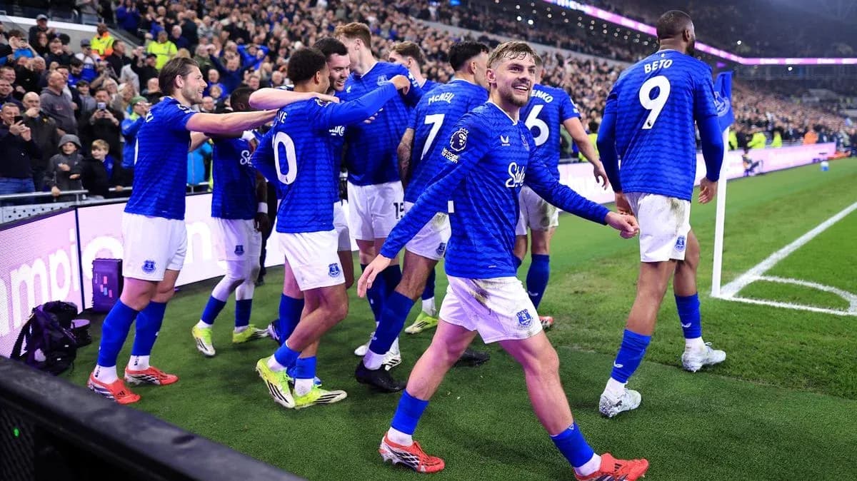 Everton players celebrating a goal with fans