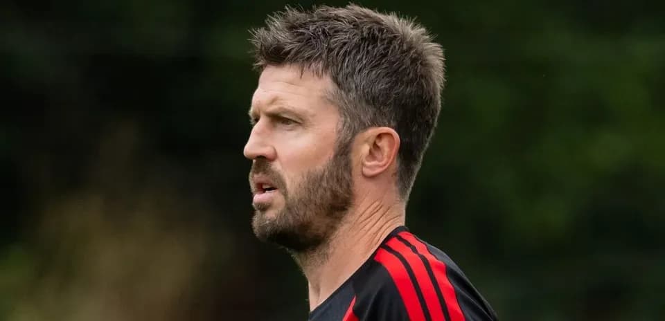 Football coach observing training session outdoors