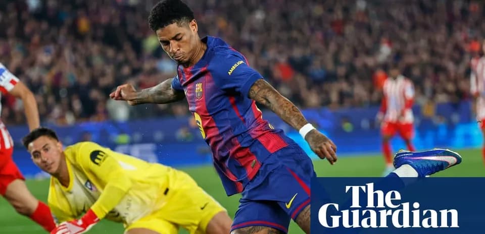 Barcelona player attempting to score against goalkeeper