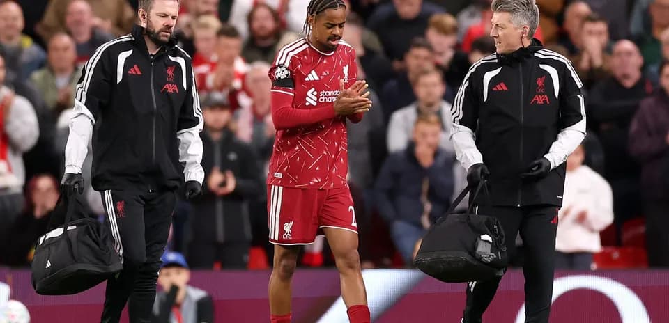 Liverpool player receiving medical attention on pitch
