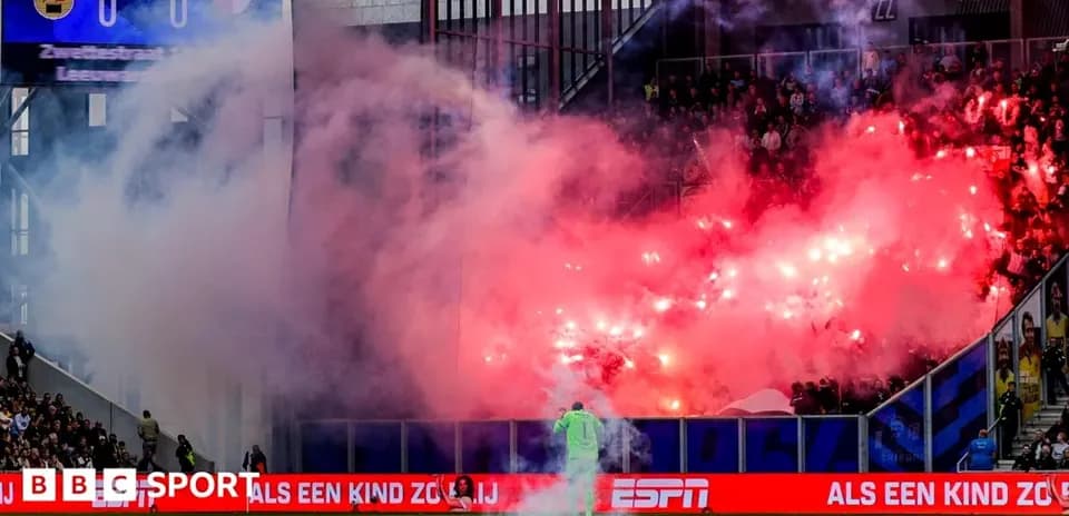 Stadium filled with smoke from flares during match