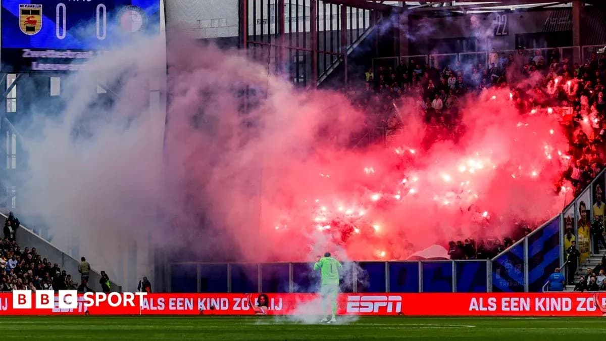 Stadium filled with smoke from flares during match