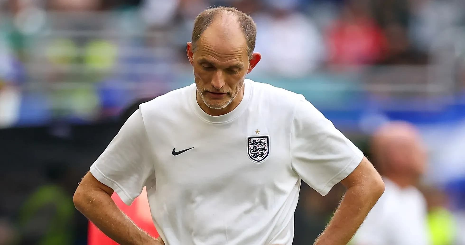 Coach walking on the field after match