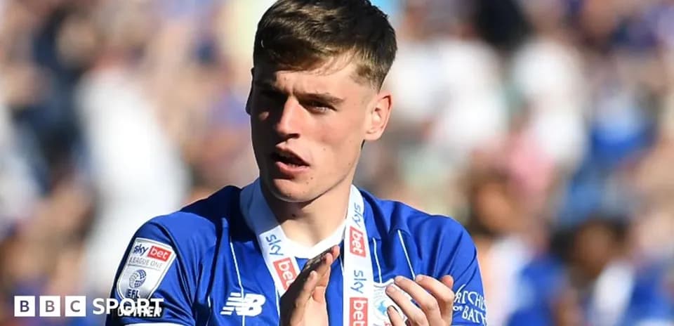 Player applauding with medal during celebration event