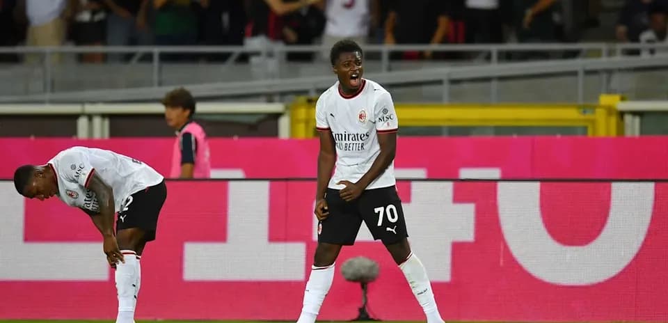 A player celebrating while another is injured nearby