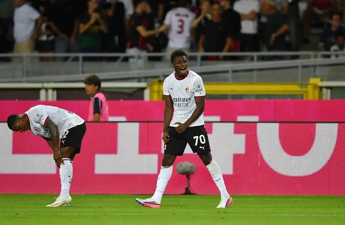 A player celebrating while another is injured nearby