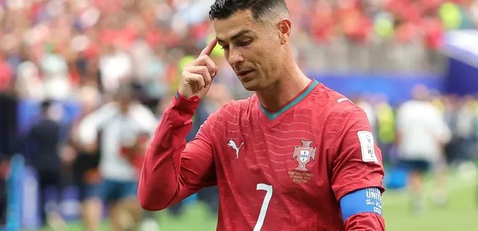Cristiano Ronaldo gesturing on the pitch during match