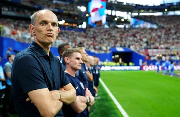 Coach observing the match from the sidelines