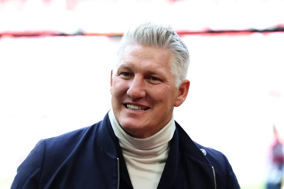 Former player smiling at stadium entrance