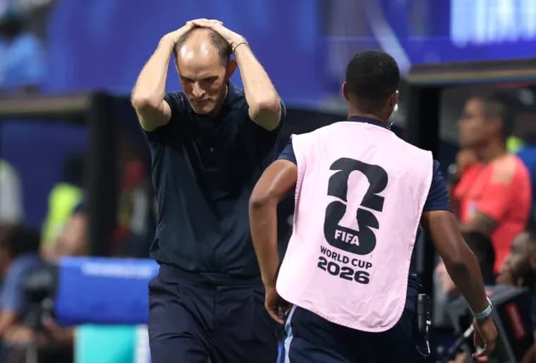 Coach with hands on head during tense moment