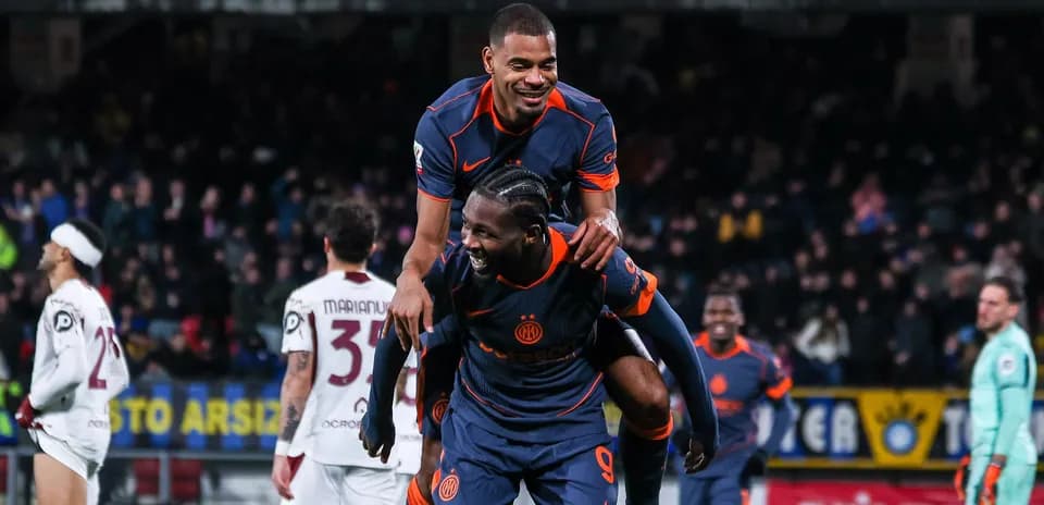 Players celebrating on the field after a goal